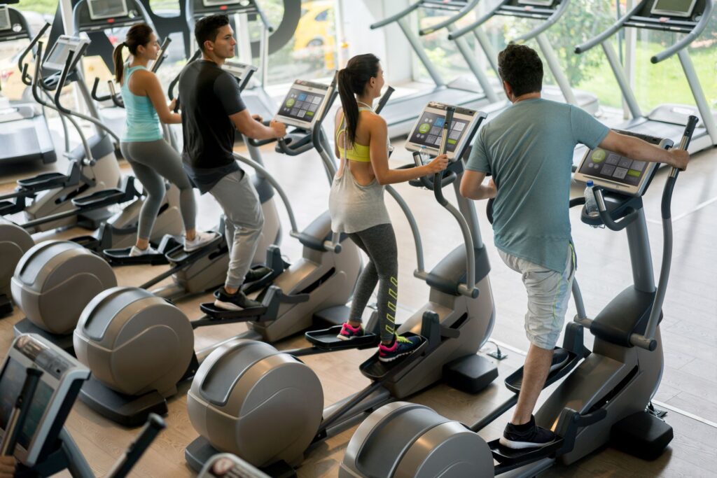 This image has an empty alt attribute; its file name is group-of-people-at-the-gym-exercising-on-cross-royalty-free-image-841075080-1548352773.jpg